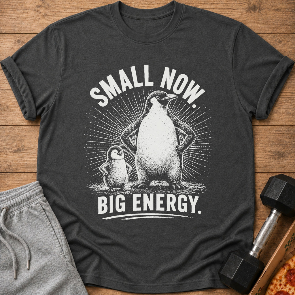 T-shirt with two penguins, large and small, and text "SMALL NOW. BIG ENERGY."