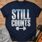 Navy t-shirt with "STILL COUNTS" and barbell graphic