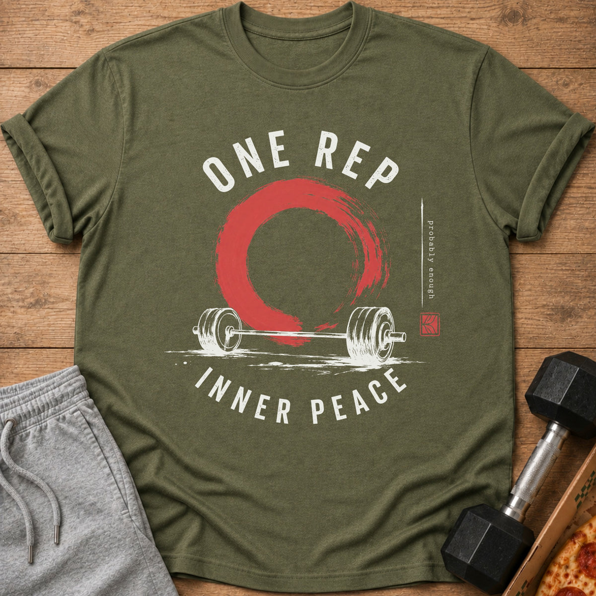 Green t-shirt with "ONE REP INNER PEACE" text, barbell, and red circle graphic.