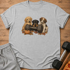 Three puppies on a dumbbell with autumn leaves and a pumpkin.