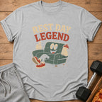 Grey t-shirt with "REST DAY LEGEND" text and cartoon couch character.