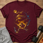 Maroon t-shirt with a surreal print of a giant frog wearing sunglasses and a small frog holding a dumbbell.