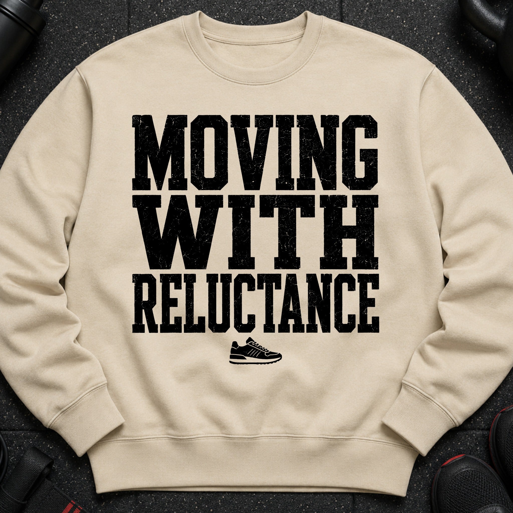 Light beige sweatshirt with black distressed text and a sneaker graphic.