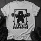 Black bear lifting weights on a squat rack with text "UNDER BAR PRESSURE".