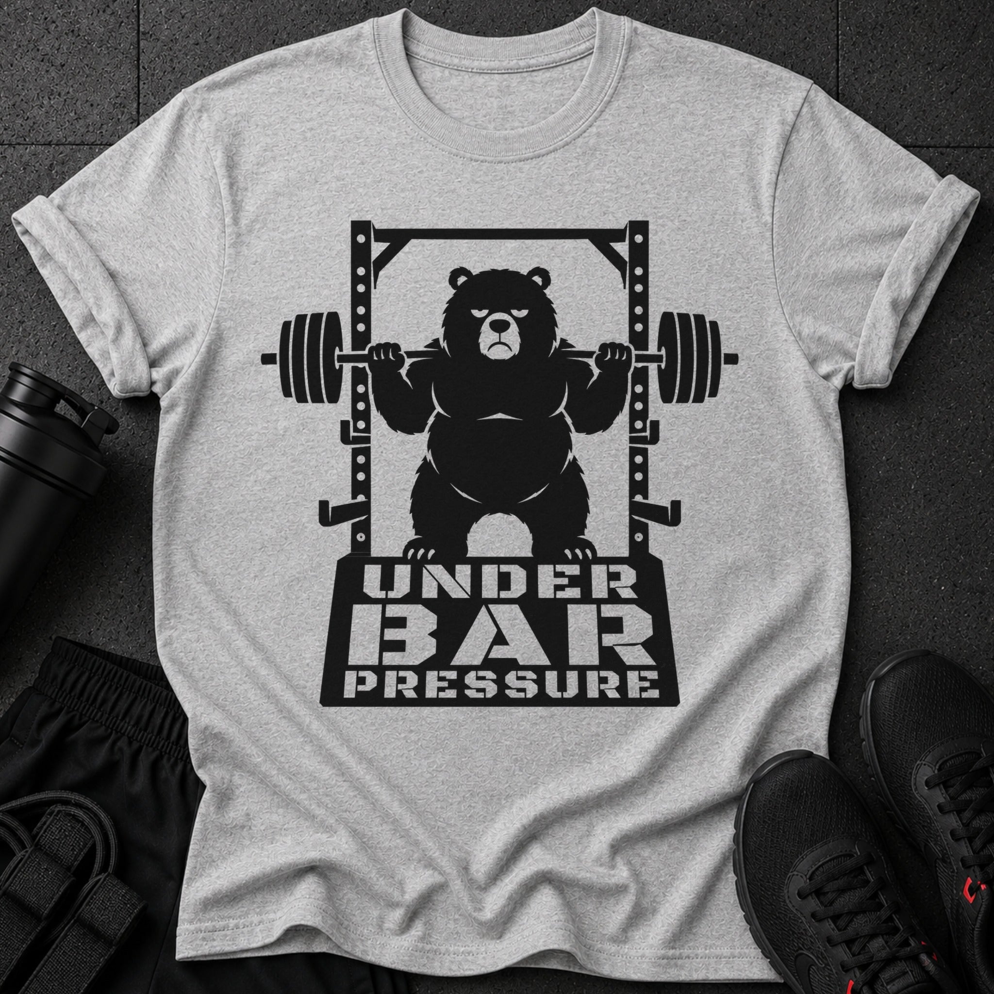 Black bear lifting weights on a squat rack with text "UNDER BAR PRESSURE".