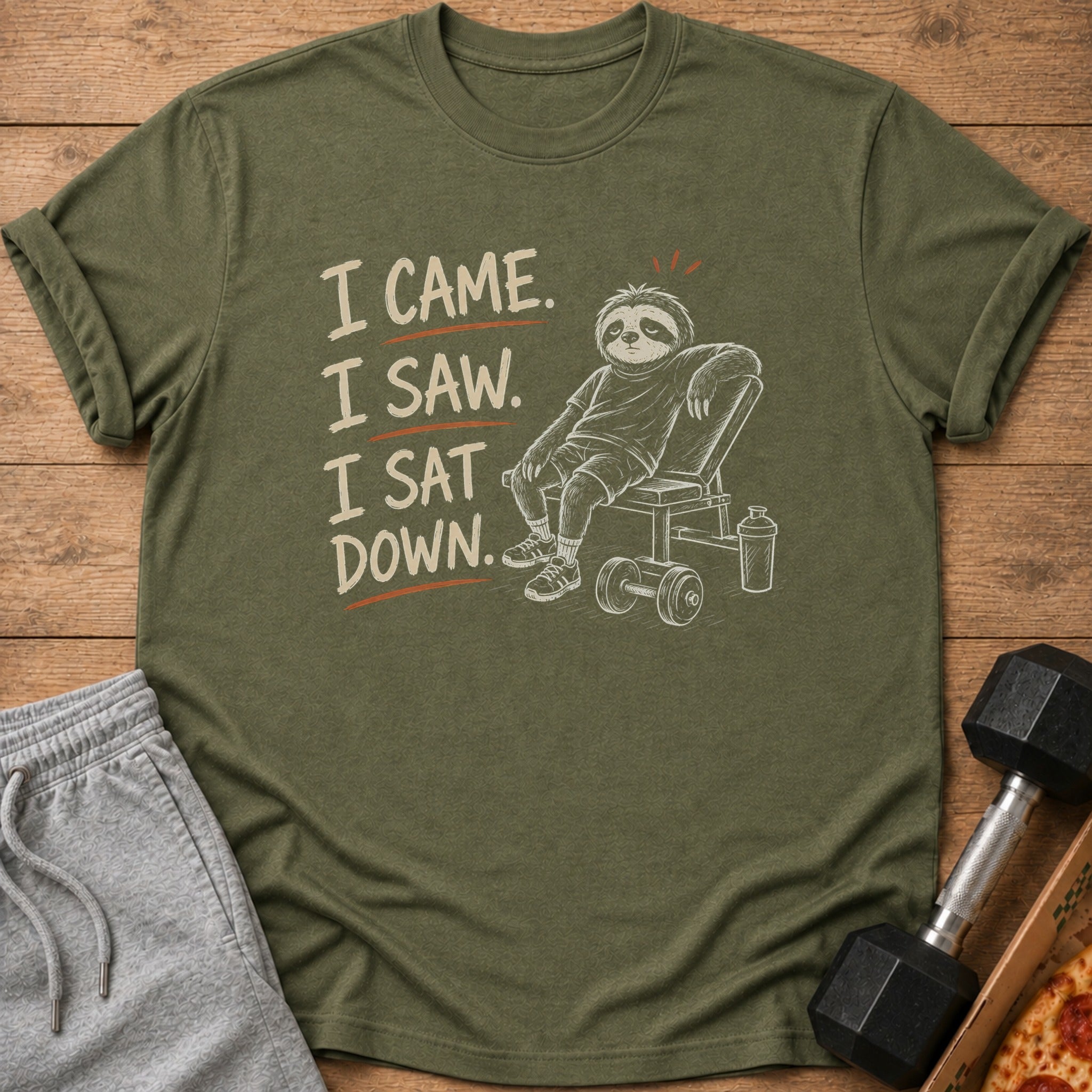 Olive green t-shirt with sloth graphic and "I came. I saw. I sat down." text.