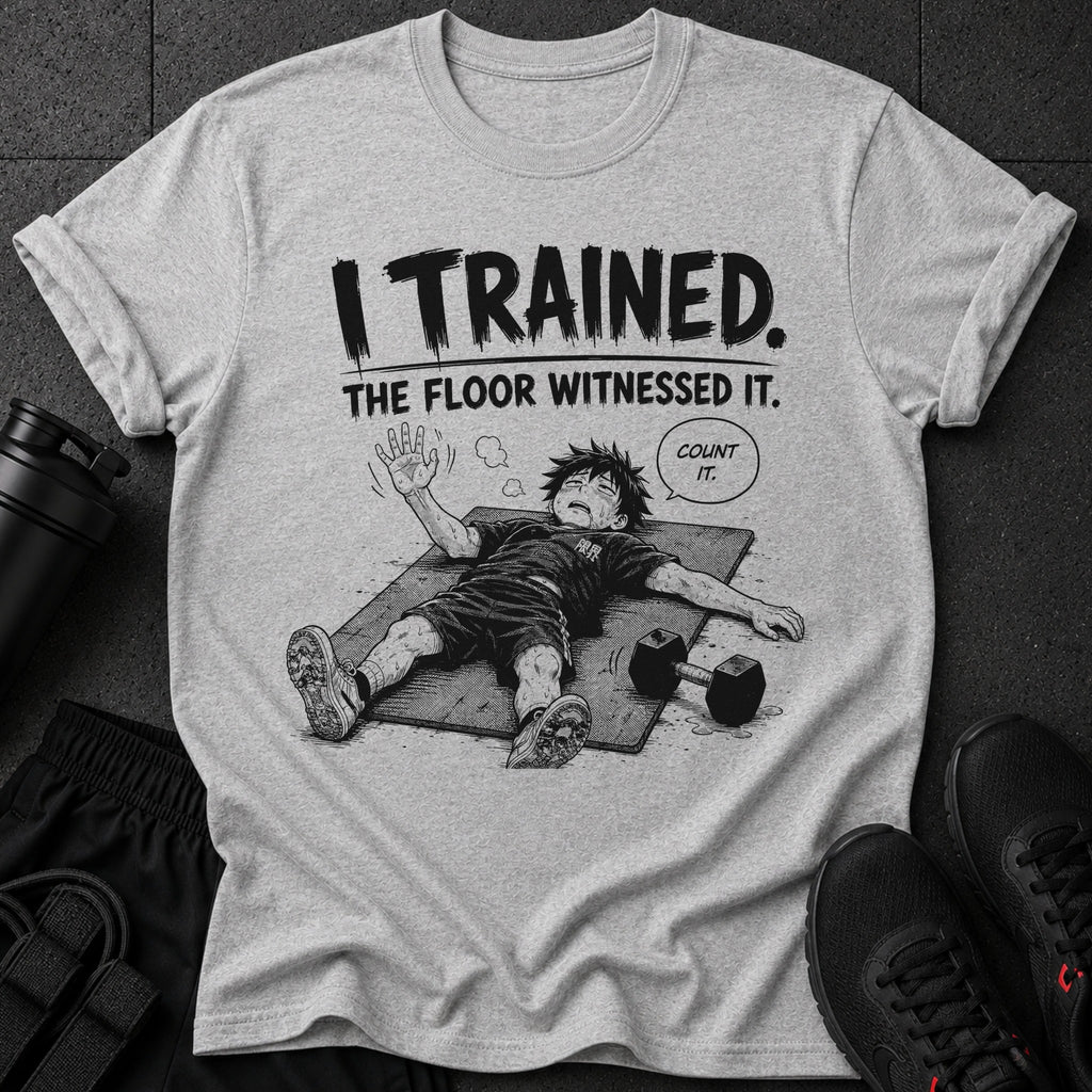 Graphic tee with "I TRAINED. THE FLOOR WITNESSED IT." and exhausted anime character.