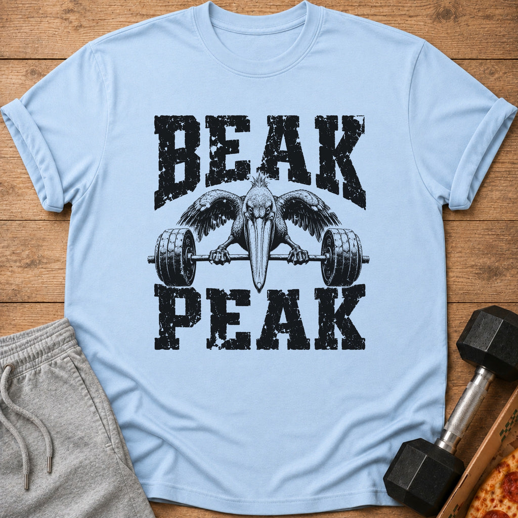 Light blue t-shirt with distressed black text "BEAK PEAK" and a pelican lifting a barbell.