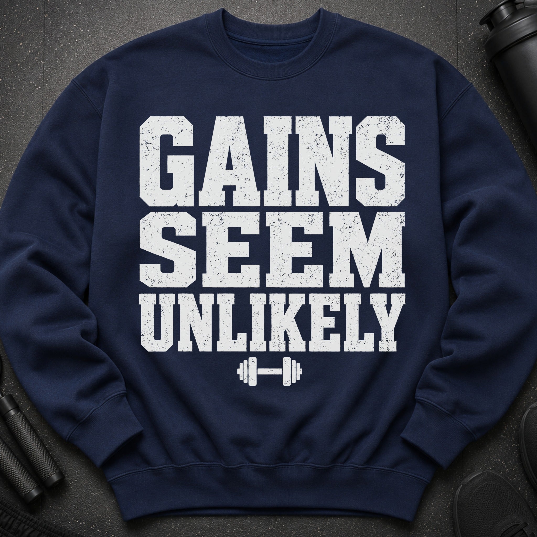 Navy sweatshirt with "Gains Seem Unlikely" and dumbbell graphic.