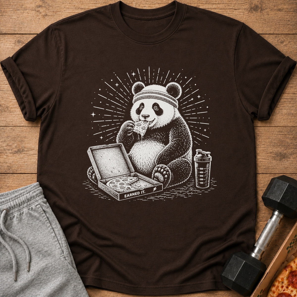 Panda wearing headband eating pizza from box, next to shaker and dumbbell.