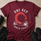 Maroon t-shirt with "ONE REP INNER PEACE" text, barbell, and zen circle graphic.