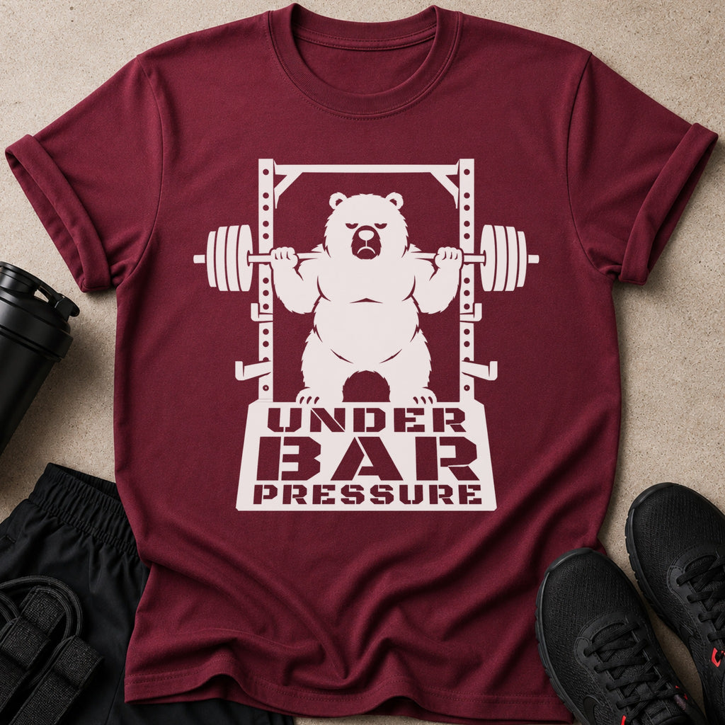 Maroon t-shirt with a white graphic of a bear lifting a barbell and text "UNDER BAR PRESSURE".