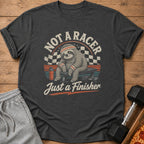 Dark grey t-shirt with a sloth graphic that reads "Not a Racer, Just a Finisher."