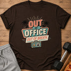 Brown t-shirt with retro "Out of Office Out of Breath" graphic and suitcase.