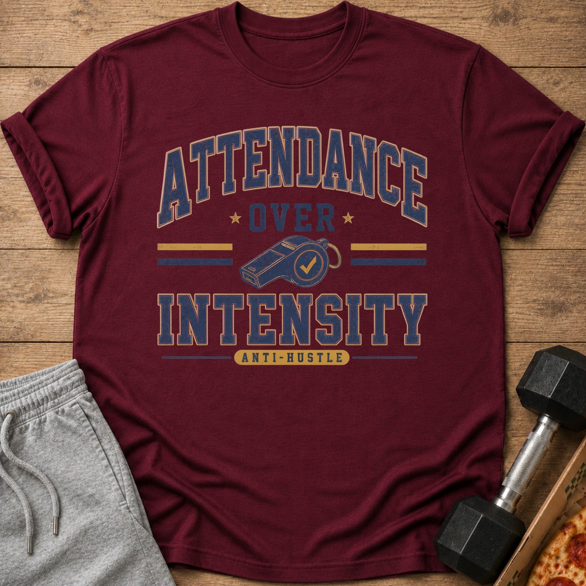 Maroon t-shirt with "Attendance Over Intensity Anti-Hustle" graphic and whistle design.