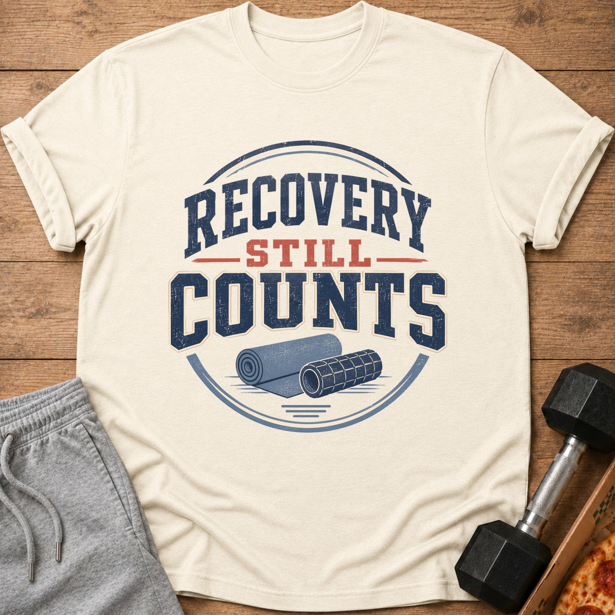 Cream t-shirt with "Recovery Still Counts" text and yoga mat illustration.