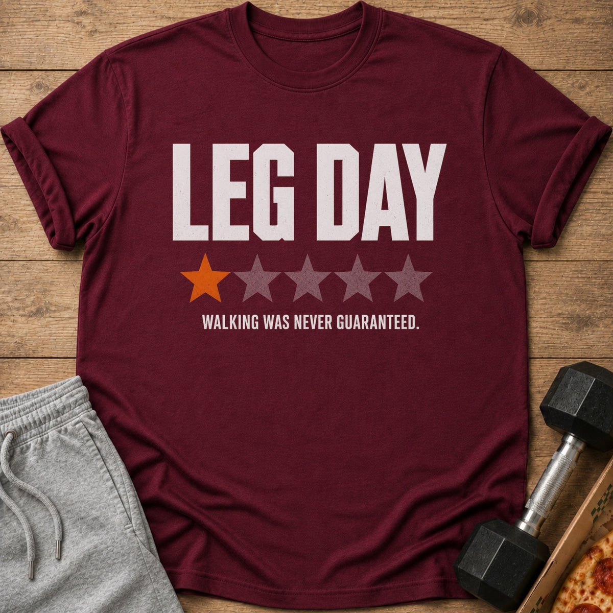 Maroon t-shirt with "LEG DAY" and "WALKING WAS NEVER GUARANTEED."