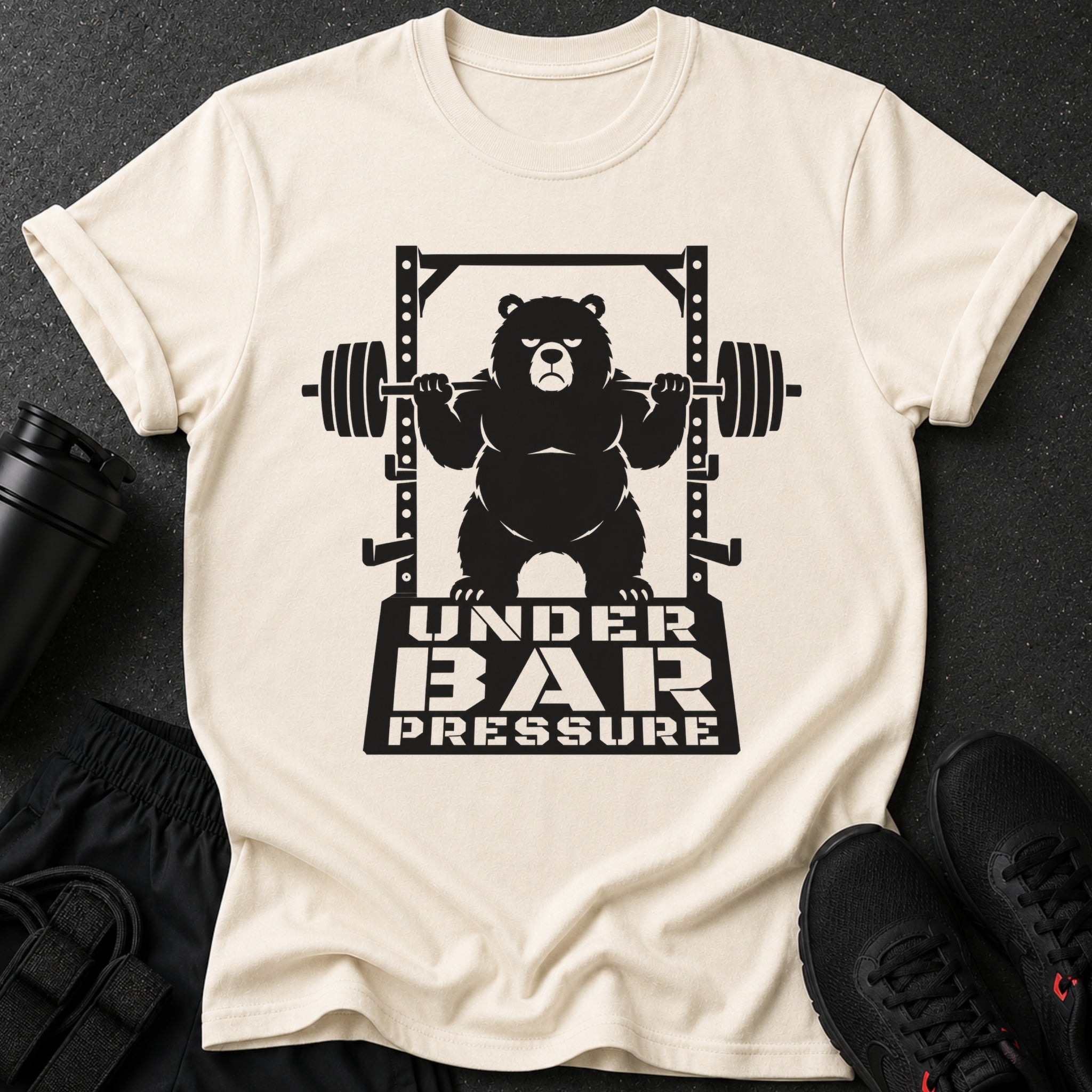 T-shirt features a black graphic of a bear lifting weights with text "UNDER BAR PRESSURE".