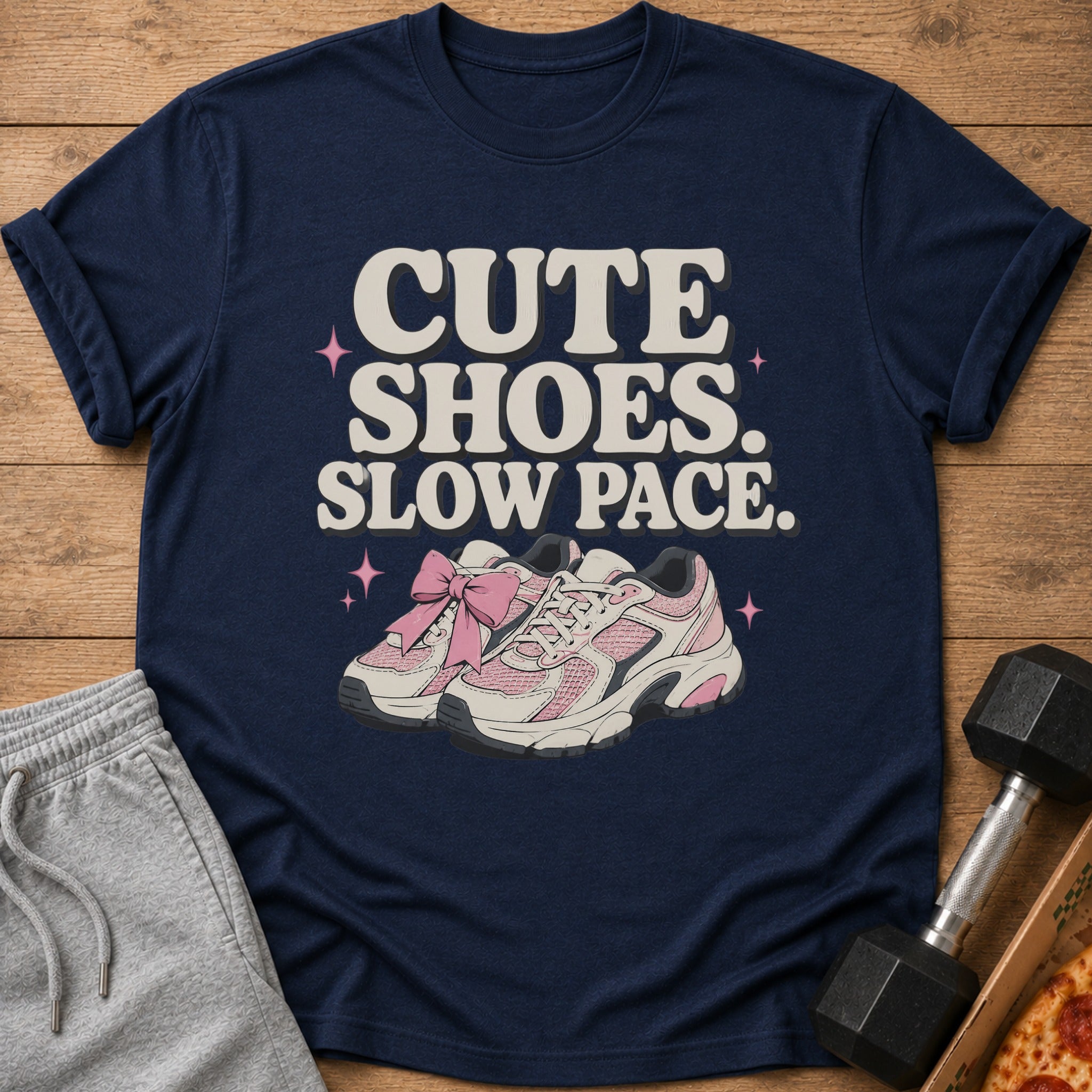 Navy t-shirt with "CUTE SHOES. SLOW PACE." text and pink sneakers graphic.