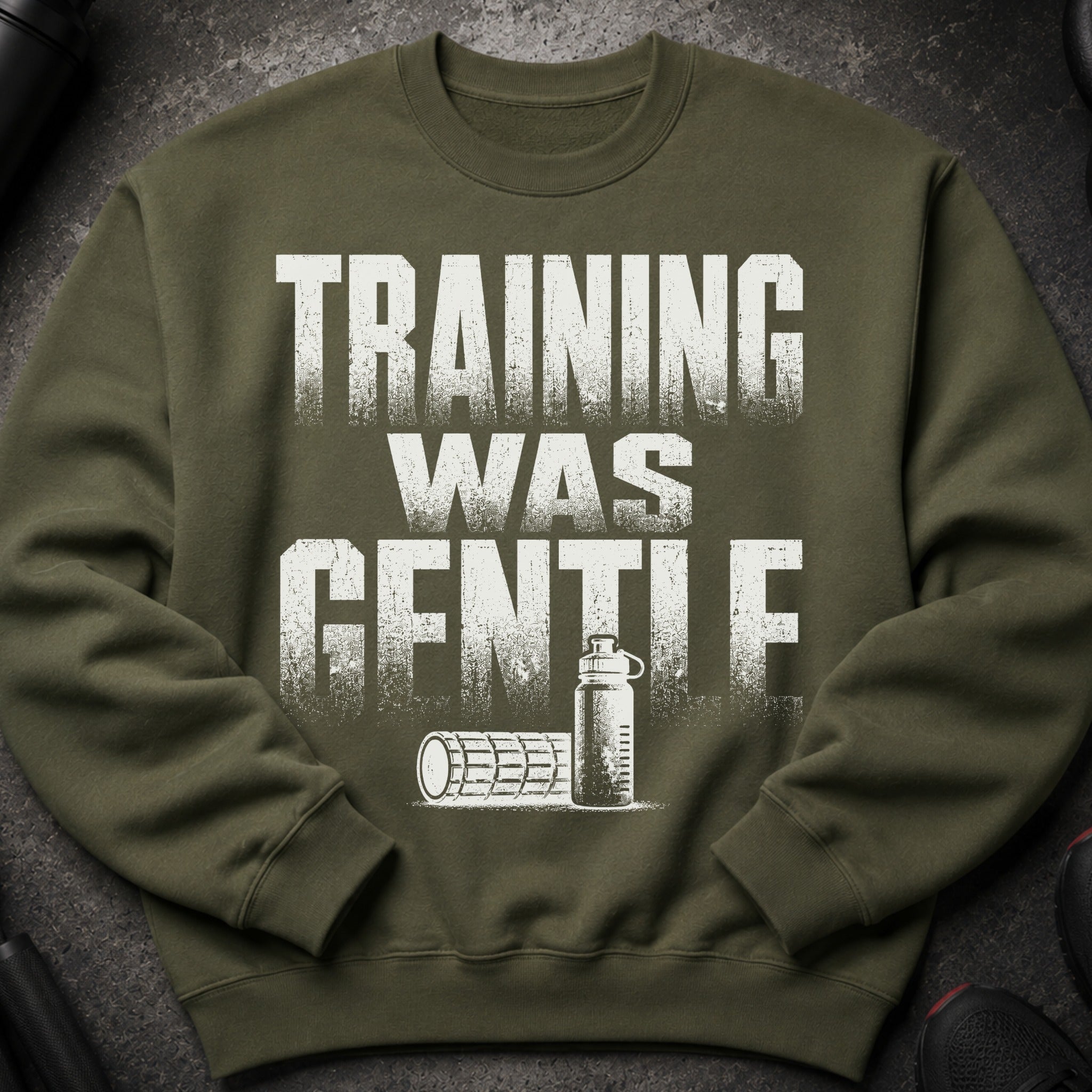 Green sweatshirt with white text "TRAINING WAS GENTLE" and gym illustration.