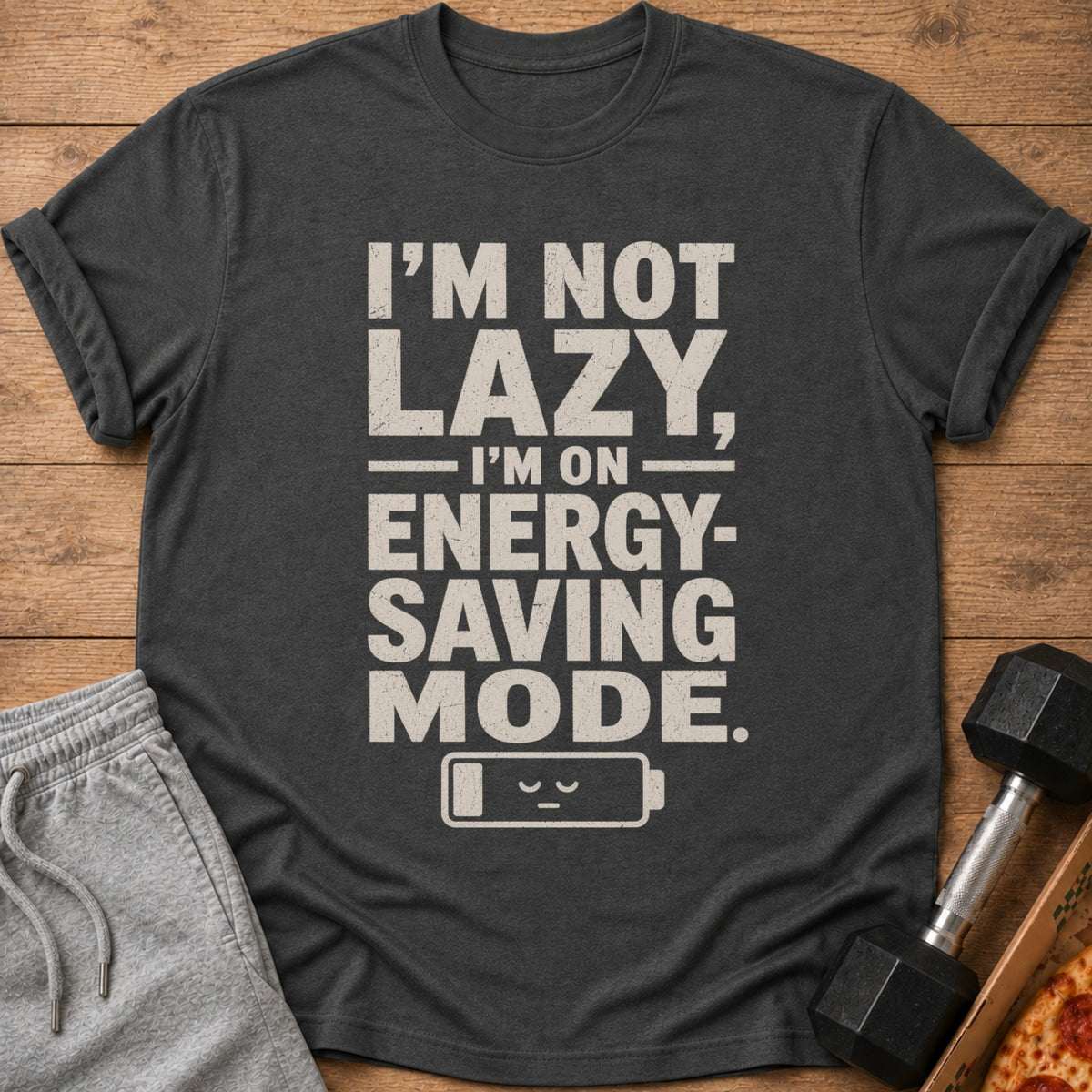 Dark t-shirt with "I'M NOT LAZY, I'M ON ENERGY-SAVING MODE." text and battery icon.