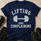 Navy t-shirt with white distressed text "Lifting and Complaining" and barbell graphic.