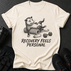Opossum on foam roller with dumbbell and text "RECOVERY FEELS PERSONAL".