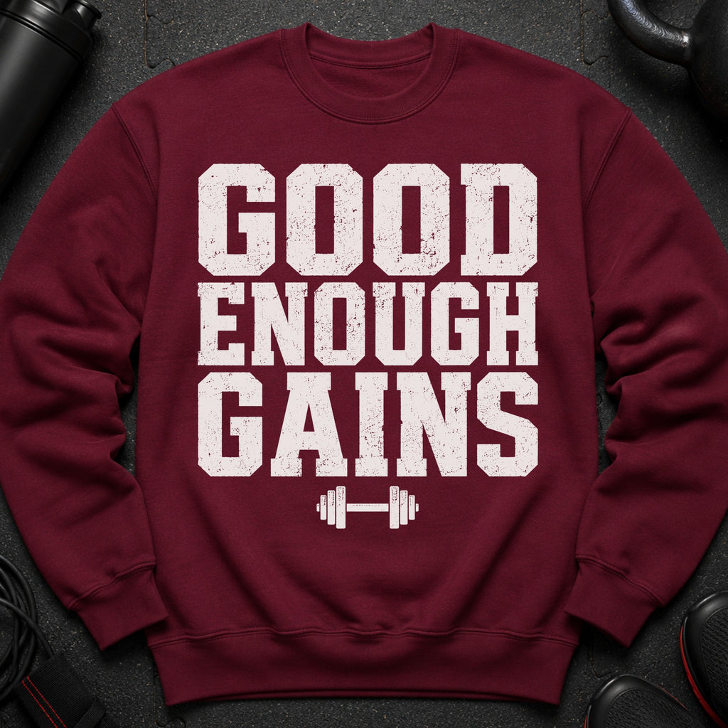 Maroon sweatshirt with white "GOOD ENOUGH GAINS" text and dumbbell graphic.