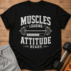 Black t-shirt with "Muscles Loading. Attitude Ready." text and dumbbell graphic.