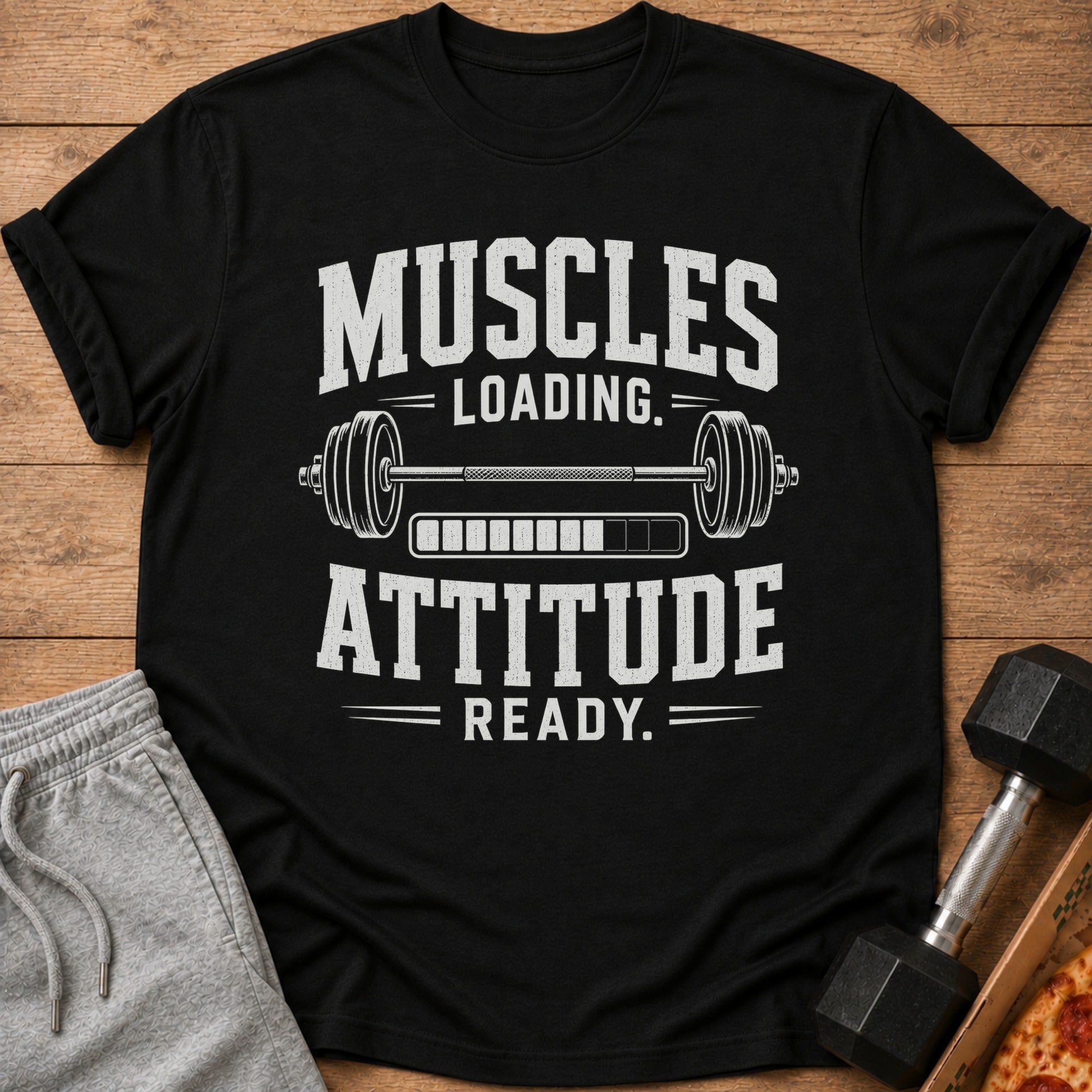 Black t-shirt with "Muscles Loading. Attitude Ready." text and dumbbell graphic.