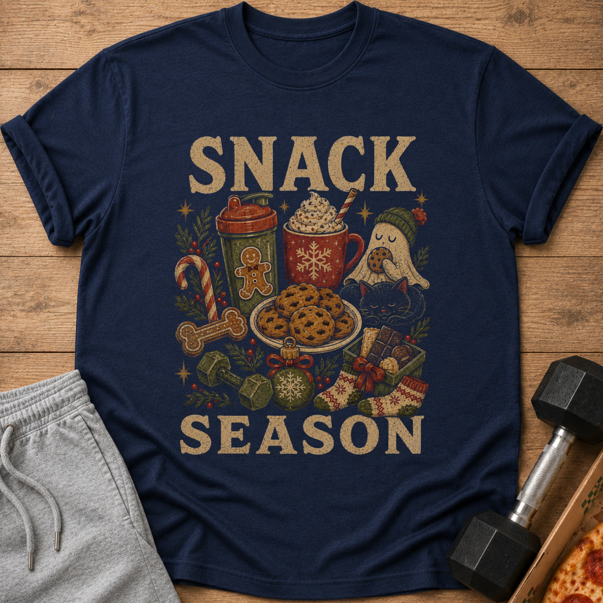 Navy t-shirt with "SNACK SEASON" text and holiday-themed fitness and treat graphics.