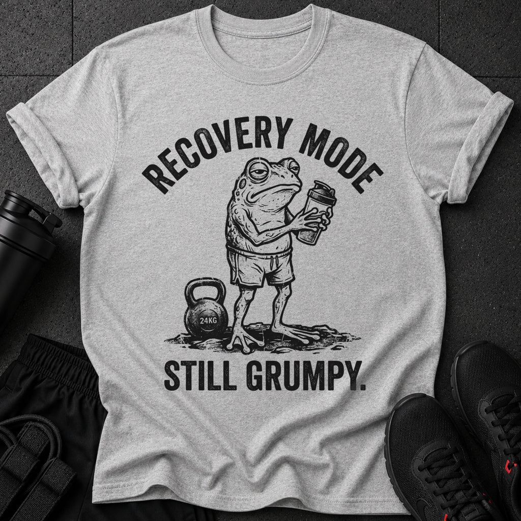 Grumpy frog in gym shorts holding a shaker bottle with text "RECOVERY MODE STILL GRUMPY."