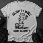 Grumpy frog in gym shorts holding a shaker bottle with text "RECOVERY MODE STILL GRUMPY."