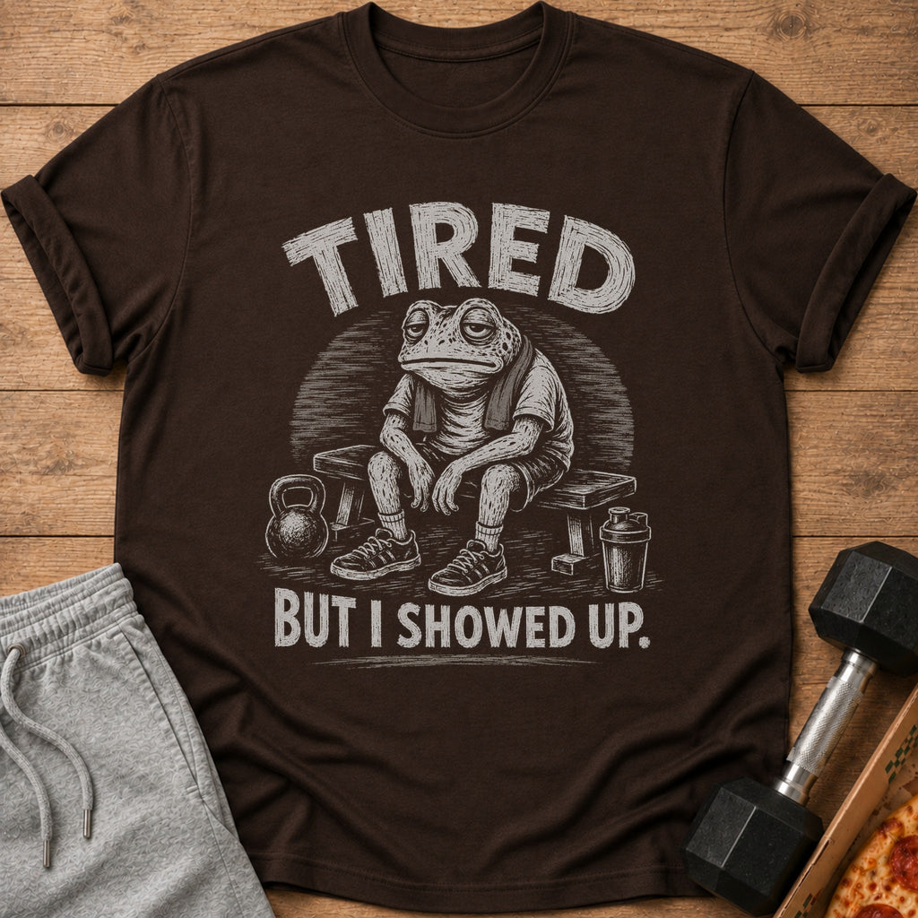 Brown t-shirt with tired frog graphic and text "TIRED BUT I SHOWED UP."
