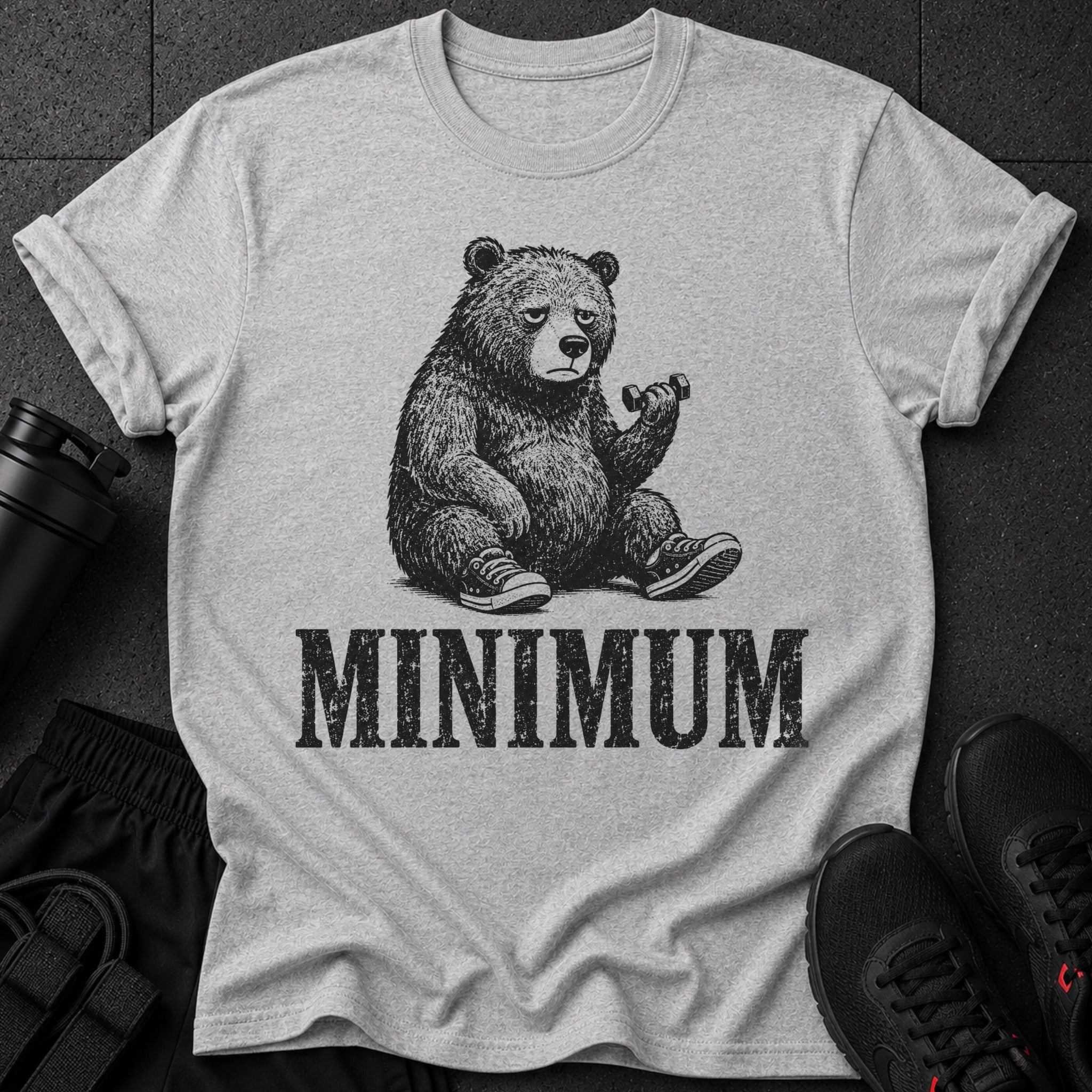 T-shirt with graphic of a bear holding dumbbell and text "MINIMUM".