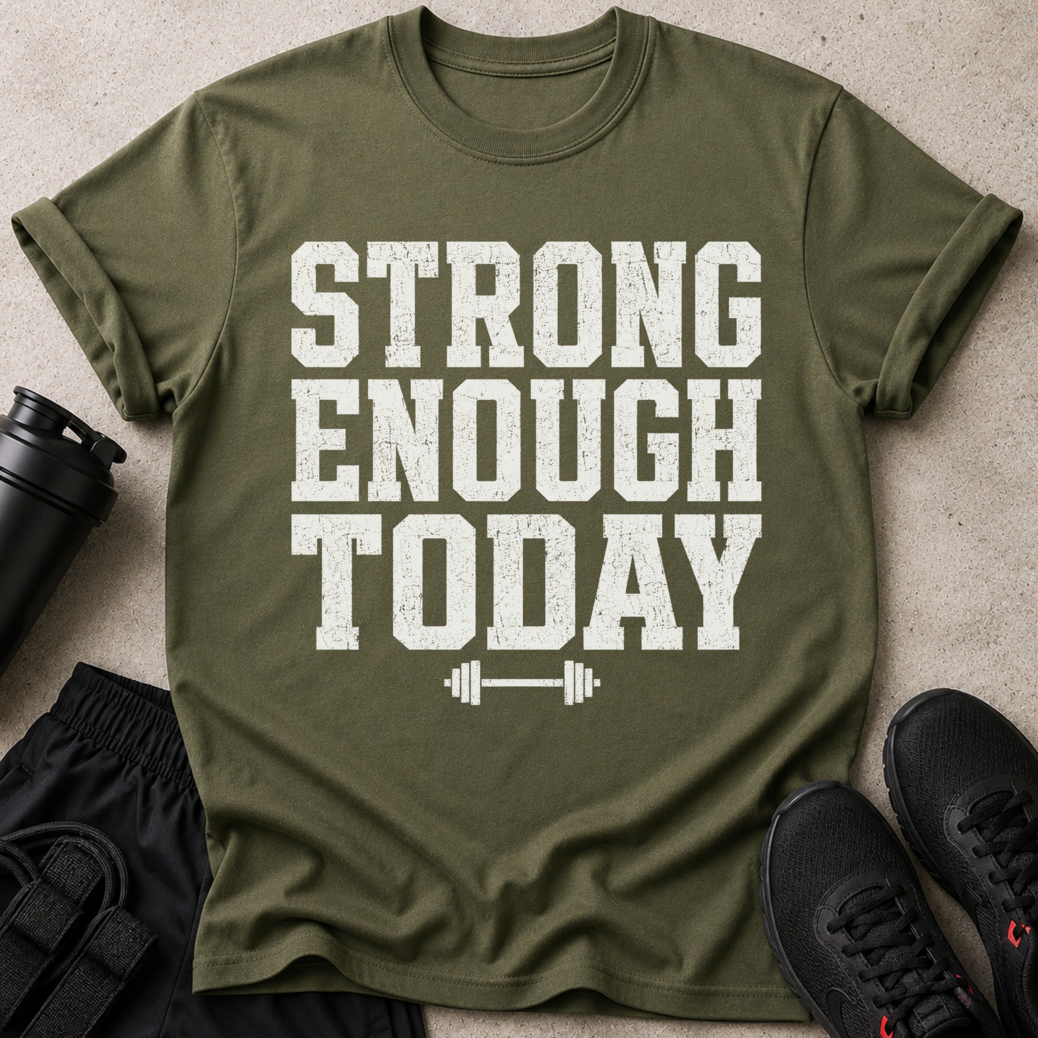 Green t-shirt with "STONG ENOUGH TODAY" text and barbell graphic.
