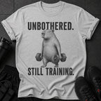 T-shirt with a capybara lifting dumbbells and text "UNBOTHERED. STILL TRAINING."