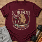 Maroon t-shirt graphic of a capybara on a treadmill, drinking a beverage.