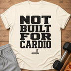 Cream t-shirt with "NOT BUILT FOR CARDIO" text and treadmill graphic.