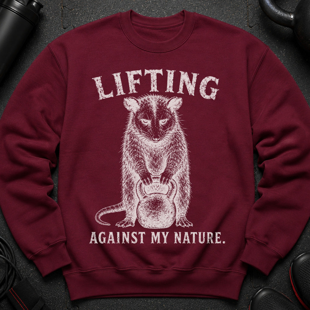 Maroon sweatshirt with distressed white graphic of an animal holding a kettlebell and text.