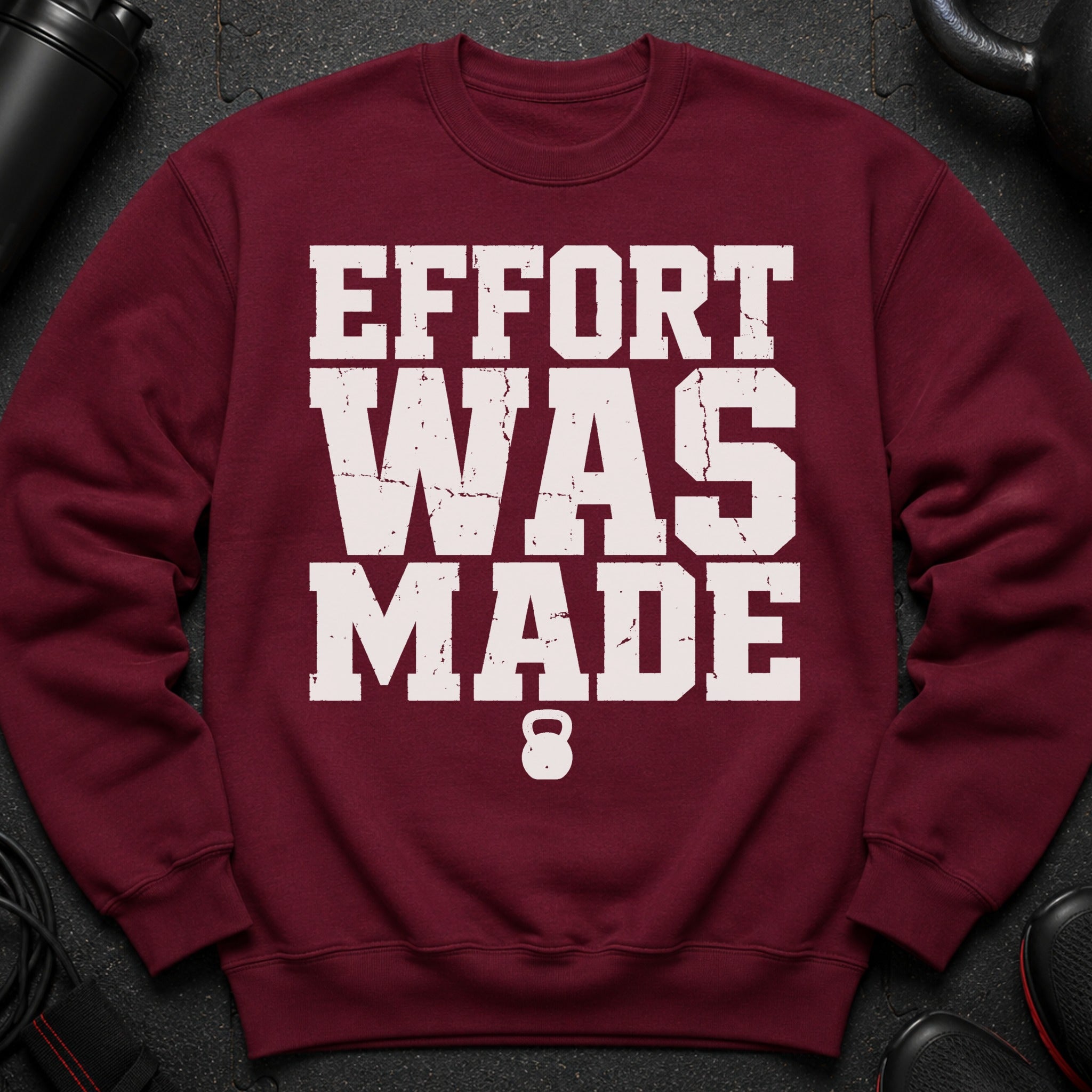 Maroon sweatshirt with distressed text "EFFORT WAS MADE" and a kettlebell graphic.