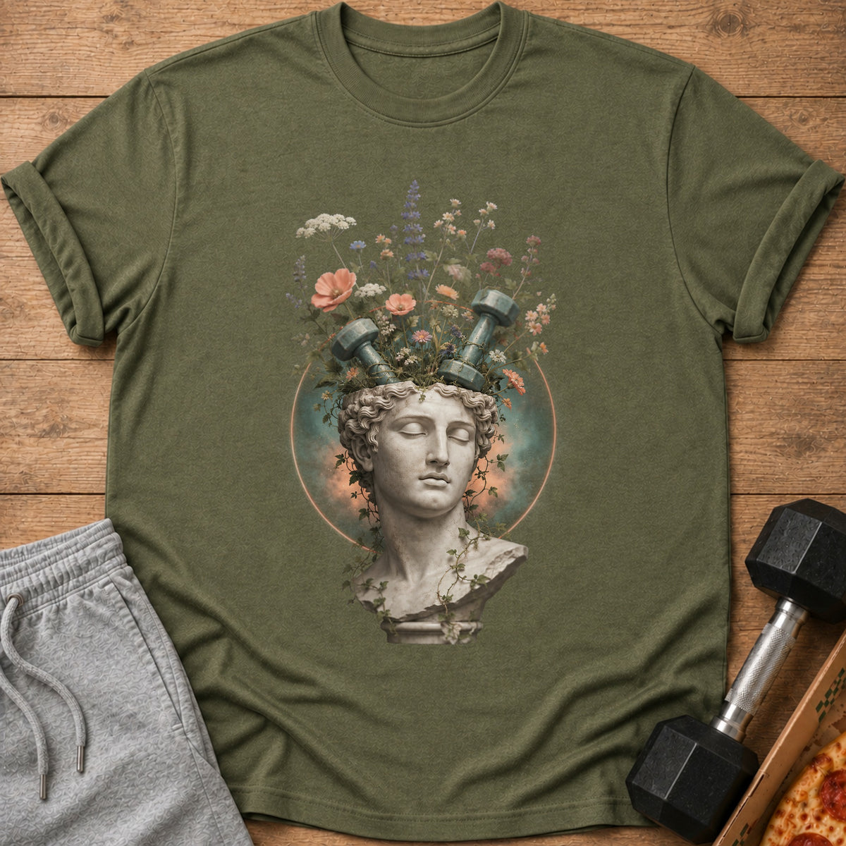 Sculpted head with dumbbells and flowers emerging from it, on a t-shirt.