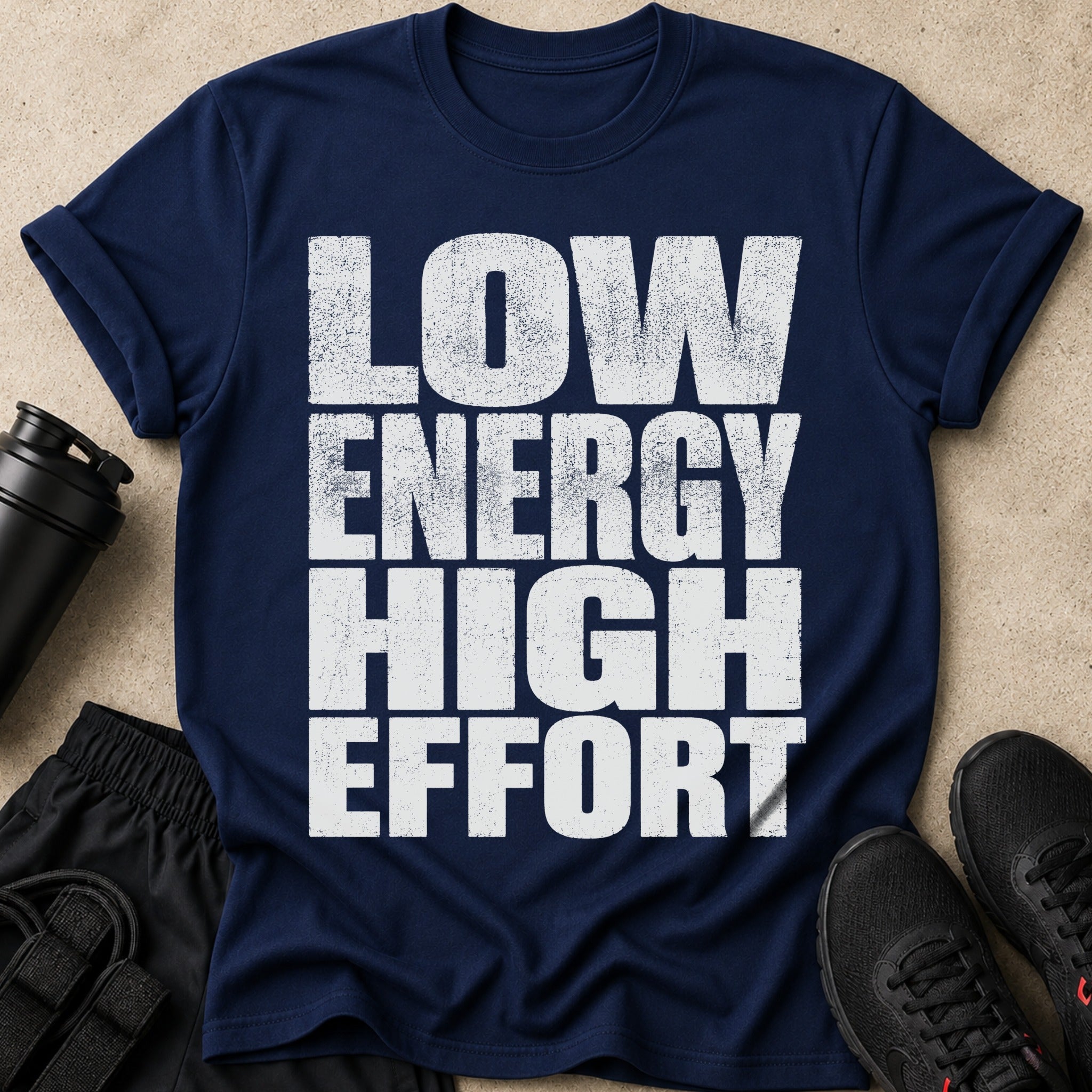 Navy t-shirt with distressed white text: LOW ENERGY HIGH EFFORT.