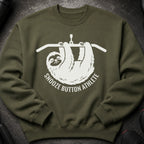 Green sweatshirt with white graphic of a sloth on a pull-up bar saying "Snooze Button Athlete".