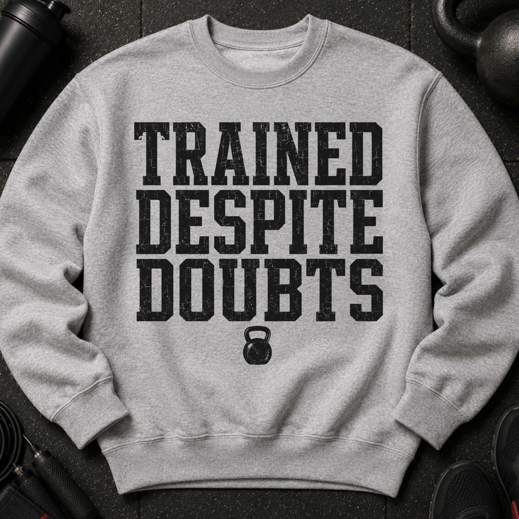 Gray sweatshirt with "TRAINED DESPITE DOUBTS" text and kettlebell graphic.