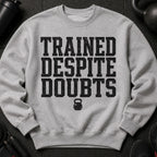 Gray sweatshirt with "TRAINED DESPITE DOUBTS" text and kettlebell graphic.