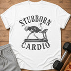 White t-shirt with black graphic of ostrich running on treadmill, text reads "STUBBORN CARDIO".