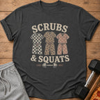 Dark t-shirt with "Scrubs & Squats" text and three pajama sets above a barbell.