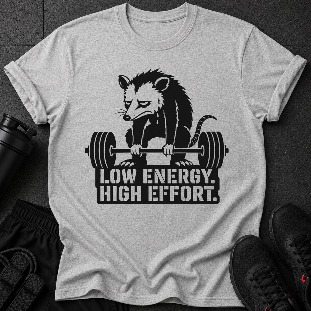 Light gray t-shirt with a black graphic of a possum lifting weights and text.