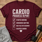 Maroon t-shirt with white text reading "CARDIO PROGRESS REPORT" and a checklist.